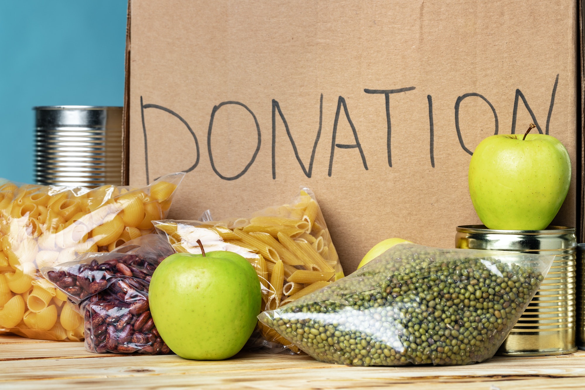 Food donations on the table. Text Donation.